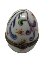 Whimsical Delight: White Egg Limoges Box with Vibrant Filigree