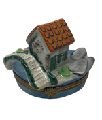 Enchanted Stone Haven: Limoges Box with Scenic Stone House and Bridge