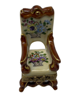 Floral Haven: Limoges Box of a Wooden Arm Chair with Painted Floral Baskets