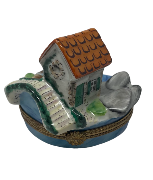 Enchanted Stone Haven: Limoges Box with Scenic Stone House and Bridge